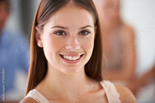 Woman, smile and portrait in office for business, working and creative employee in company. Happy, professional and girl with pride for job and excited designer in London with confidence in startup © Yuri A for PeopleImages/peopleimages.com