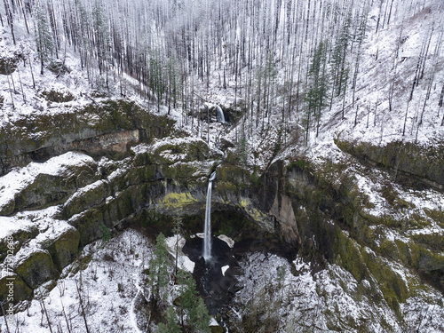 The Elowah waterfall flows over rugged, mountainous landscape in the Columbia River Gorge separating the states of Oregon and Washington. The Pacific Northwest region has incredible outdoor scenery. photo