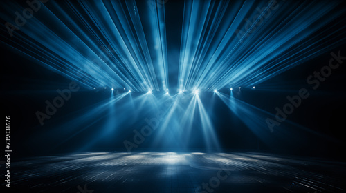 Blue stage curtain with spotlights, performance light rays, stage preparation, event production, live entertainment setup, concert ambiance, theater stage art concept. © TEERAPONG