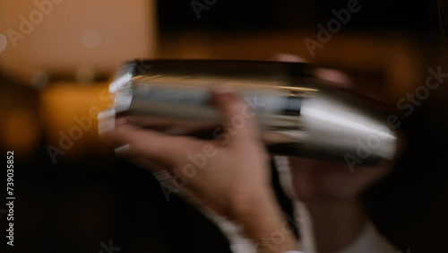 Bartender shaking a cocktail