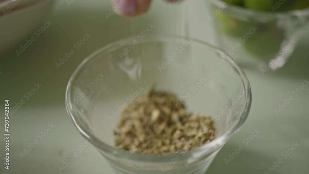 dried oregano, hand grinds and dropping oregano dried oregano, hand grinds and dropping oregano