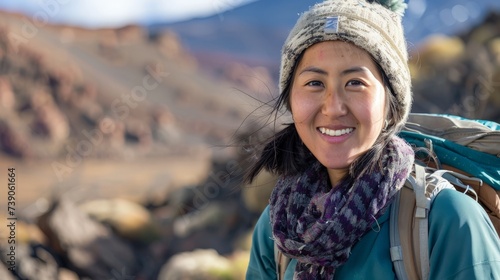 Hiker portrait. Female hiking woman happy and smiling during hike trek on volcano Teide, Tenerife, Canary Islands