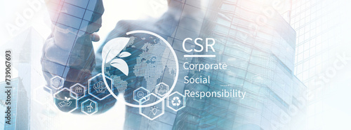 CSR, Corporate social Responsibility concept. Businessman hands shaking with global ecology, responsive business organization, environmental, sustainable and ethical business photo