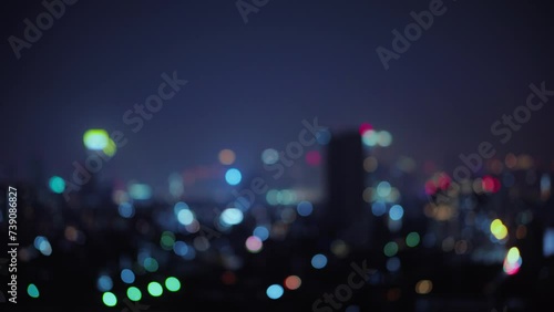 Blurred of night city skyscraper and tower lights bokeh , Soft Focus , Metropolis Backgound wallpaper for movie or documentary romantic mood concept