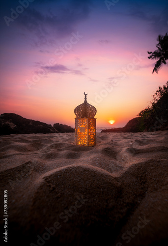 Lantern on the sand with sunset sky, Ramadan Kareem and Eid Mubarak photography