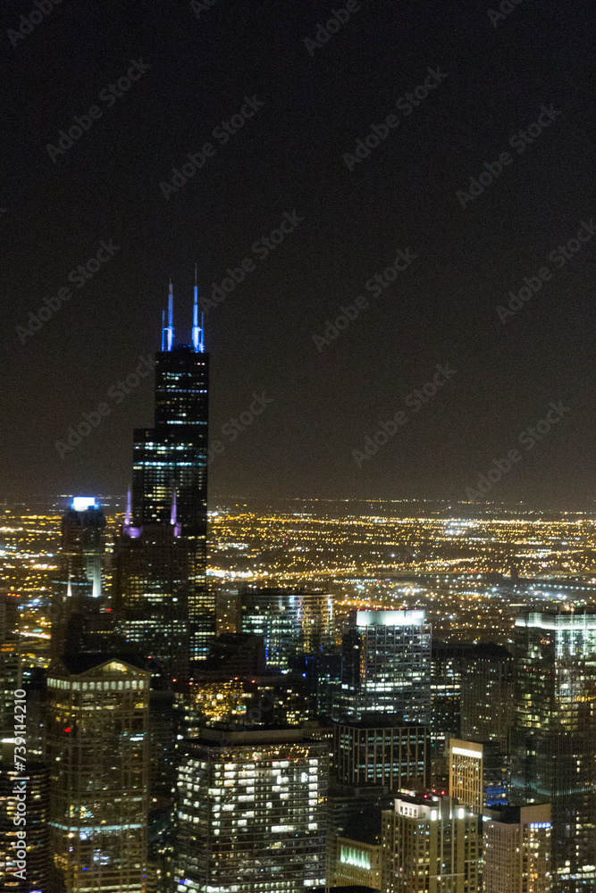 view of Chicago downtown at night from John Hancock skyscraper high above