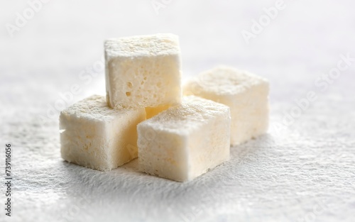 White sugar cubes on white background