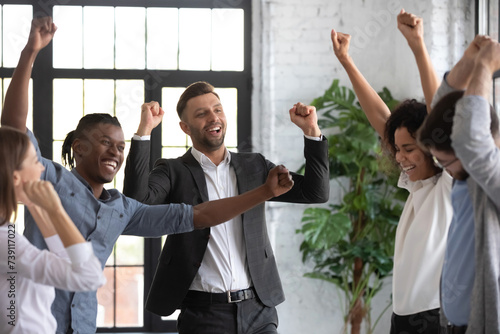 Fotografija Excited sales team members having fun after increasing sales