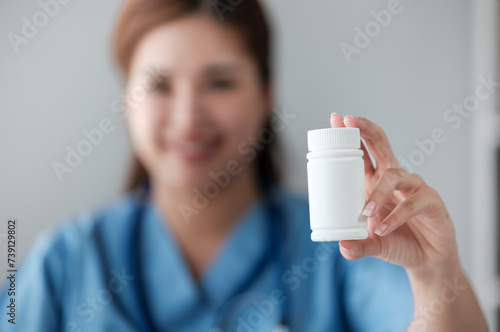 Close up view of female doctor explaining the instruction of the pills to her patient.