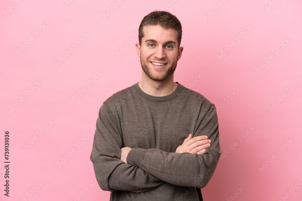 Young caucasian man isolated on pink background keeping the arms crossed in frontal position Young caucasian man isolated on pink background keeping the arms crossed in frontal position
