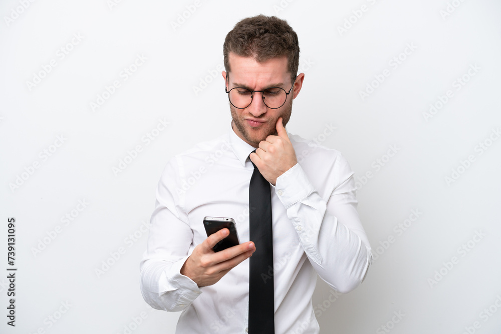 Young business caucasian man isolated on white background thinking and sending a message Young business caucasian man isolated on white background thinking and sending a message
