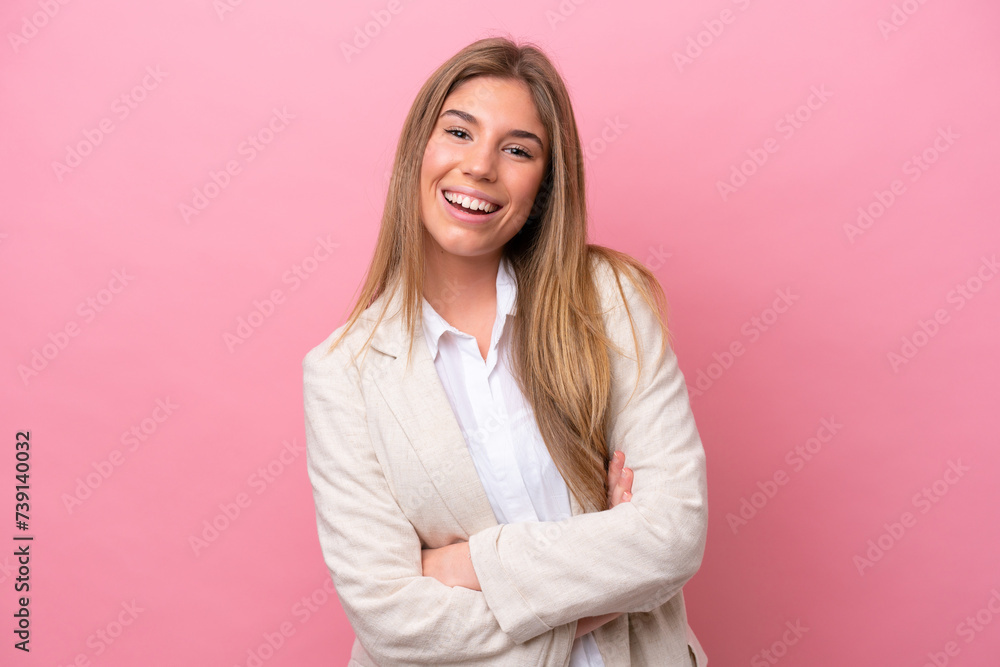 Young caucasian woman isolated on pink bakcground keeping the arms crossed in frontal position Young caucasian woman isolated on pink bakcground keeping the arms crossed in frontal position