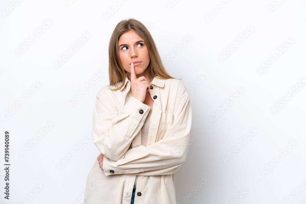 Young caucasian woman isolated on white bakcground having doubts while looking up Young caucasian woman isolated on white bakcground having doubts while looking up