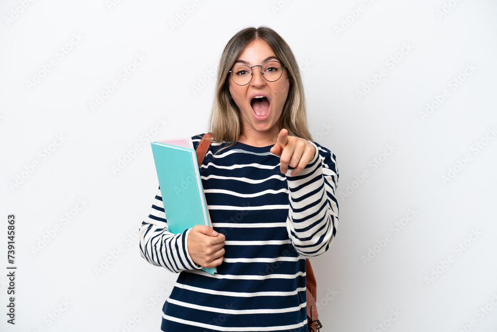 Young student Rumanian woman isolated on white background surprised and pointing front Young student Rumanian woman isolated on white background surprised and pointing front