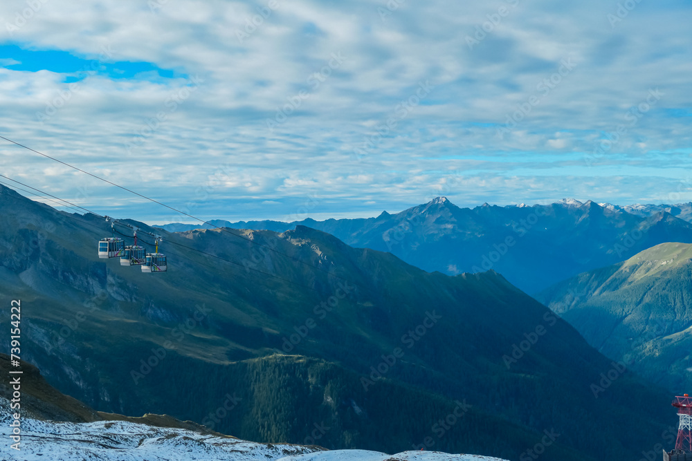 Panoramic morning view of ropeway Ankogelbahn, group cable car in High Tauern National Park, Carinthia, Austria. Wanderlust in Austrian Alps. Idyllic high altitude hiking trails at mountain Ankogel