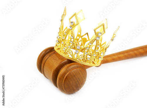 Monarchy, laws and court concept. Gold crown with judge gavel isolated on white background.	 photo