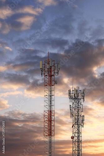 Communication tower top. Radio antenna Tower , microwave antenna tower on light sky background. wireless technology concept. communication development concept. © kanpisut