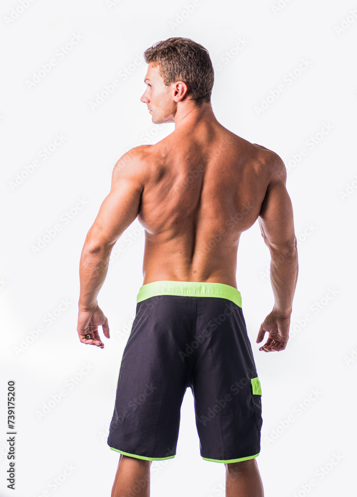 Fototapeta premium Bare-chested man standing against white background