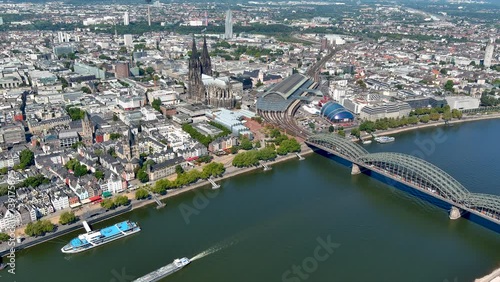 Aerial view Cologne Old Town in Germany. Above shot of over the river Rhine ft Museum Ludwig, Cathedral, Hohenzollern Bridge, Central Station, Musical Dome, on a sunny day in North Rhine-Westphalia 4K photo