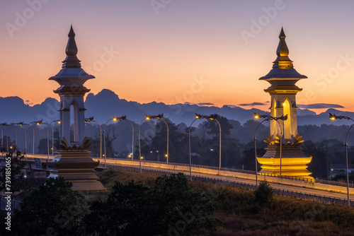 Thai-Lao Friendship Bridge in Thailand, morning and lights and mountains in Laos side