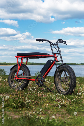 Electric fatbike against the backdrop of the lake photo