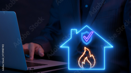 Wallpaper Mural Businessman working with computer laptop and showing animation of neon line house with shield guard with fire icon. Protection and home and fire insurance concept. Torontodigital.ca