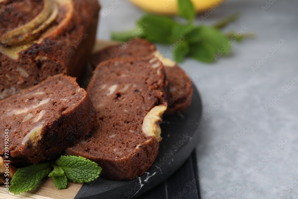 Delicious banana bread on grey table, closeup. Space for text Delicious banana bread on grey table, closeup. Space for text