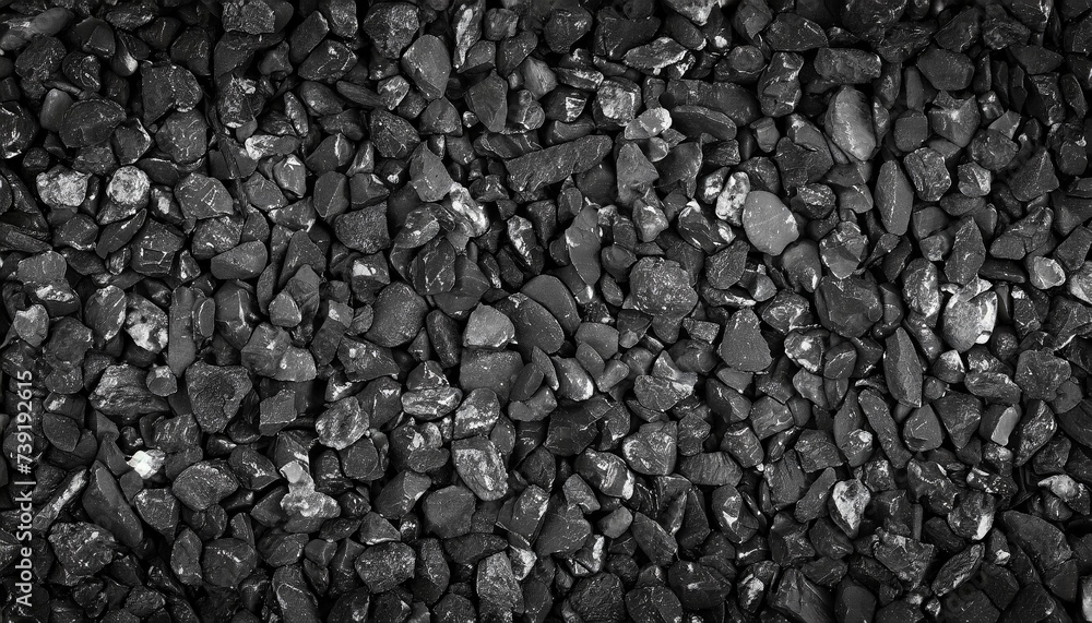 Close-up of textured black rocks or gravel, uniformly spread. Highlights natural patterns and shapes Close-up of textured black rocks or gravel, uniformly spread. Highlights natural patterns and shapes