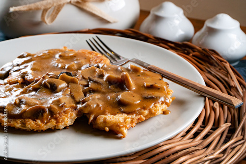 Fototapeta Naklejka Na Ścianę i Meble -  Sauerkraut pancakes /fuczka/ with mushroom sauce .