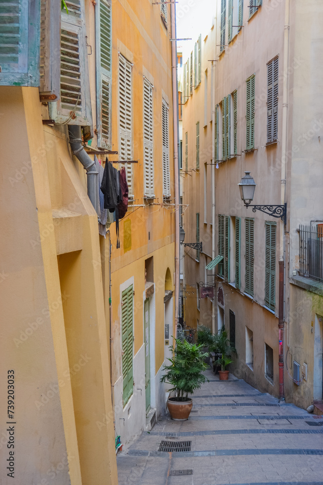 Nice, France, 02/13/2024: The architecture of the old town in Nice boasts a blend of Italian style with French motifs, characterized by colorful houses and narrow streets. Nice, France, 02/13/2024: The architecture of the old town in Nice boasts a blend of Italian style with French motifs, characterized by colorful houses and narrow streets.