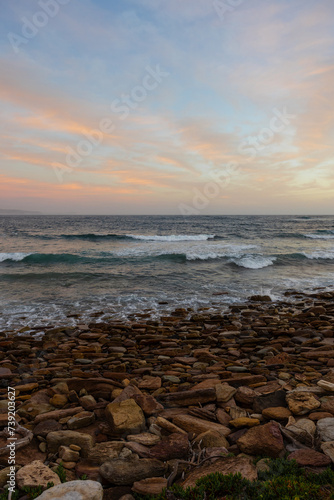Fototapeta Naklejka Na Ścianę i Meble -  Beautiful sunrise view on a rocky beach.