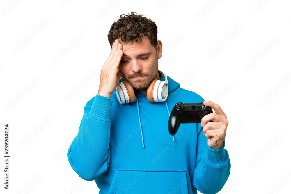 Brazilian man playing with a video game controller over isolated chroma key background with headache Brazilian man playing with a video game controller over isolated chroma key background with headache