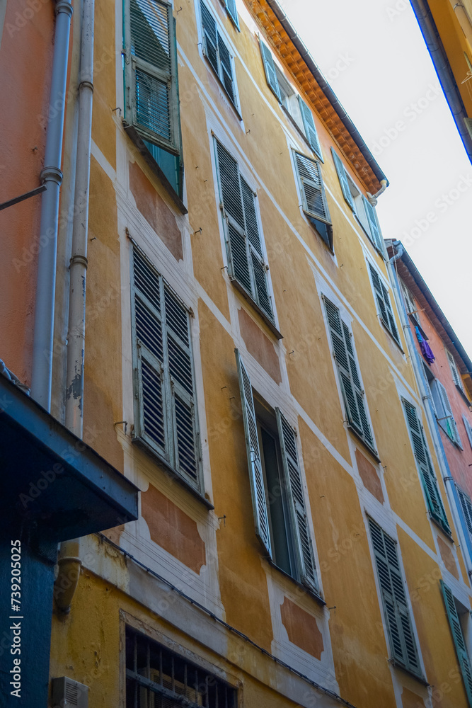 Nice, France, 02/13/2024: The architecture of the old town in Nice boasts a blend of Italian style with French motifs, characterized by colorful houses and narrow streets.