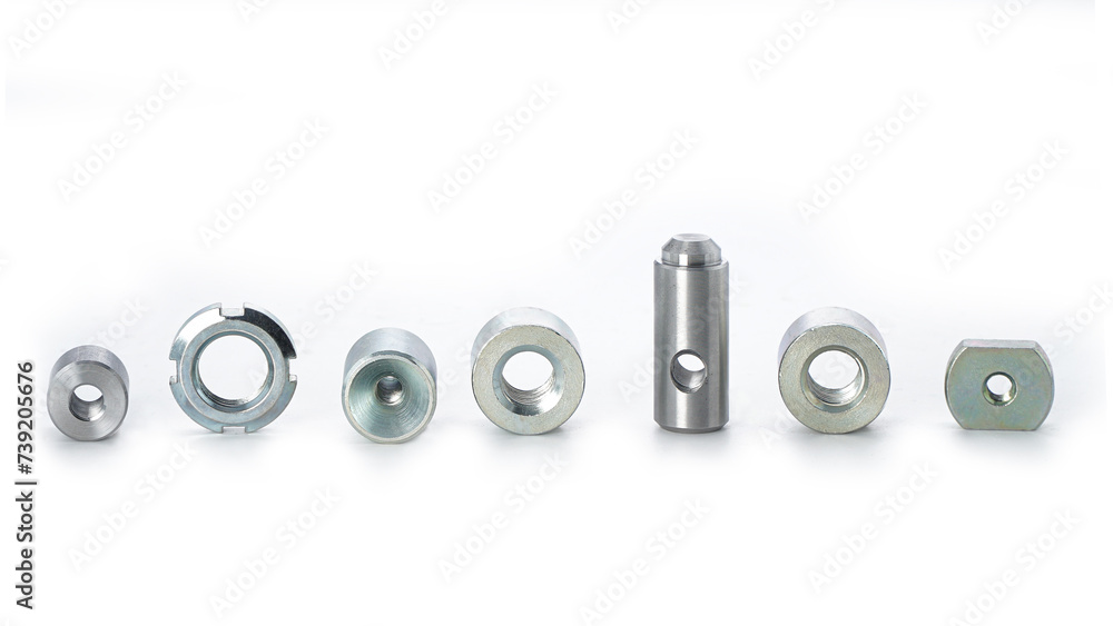An assortment of nuts and bolts on a white background An assortment of nuts and bolts on a white background