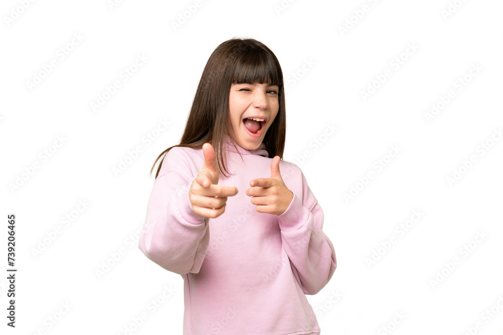 Little girl over isolated green chroma key background pointing to the front and smiling Little girl over isolated green chroma key background pointing to the front and smiling