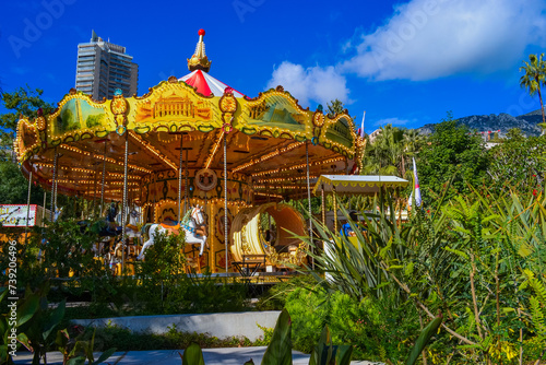 Principality of Monaco, Monaco, 13.2.2024: Bright carousel for children in the park