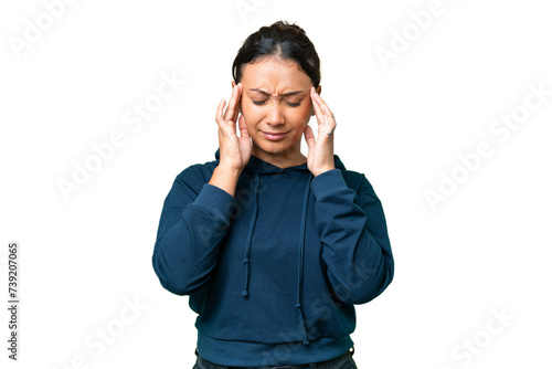Young Uruguayan woman over isolated chroma key background with headache photo
