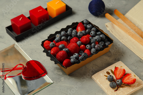 a strawberry and a blueberry