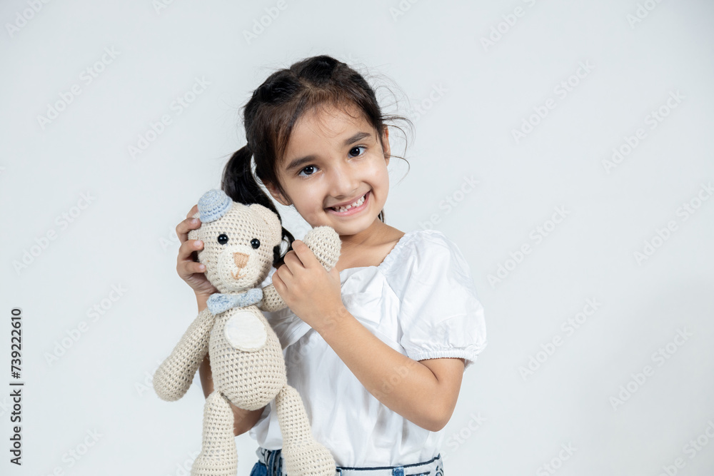 portrait of smiling Indian girl children on isolated background looking towards the camera portrait of smiling Indian girl children on isolated background looking towards the camera