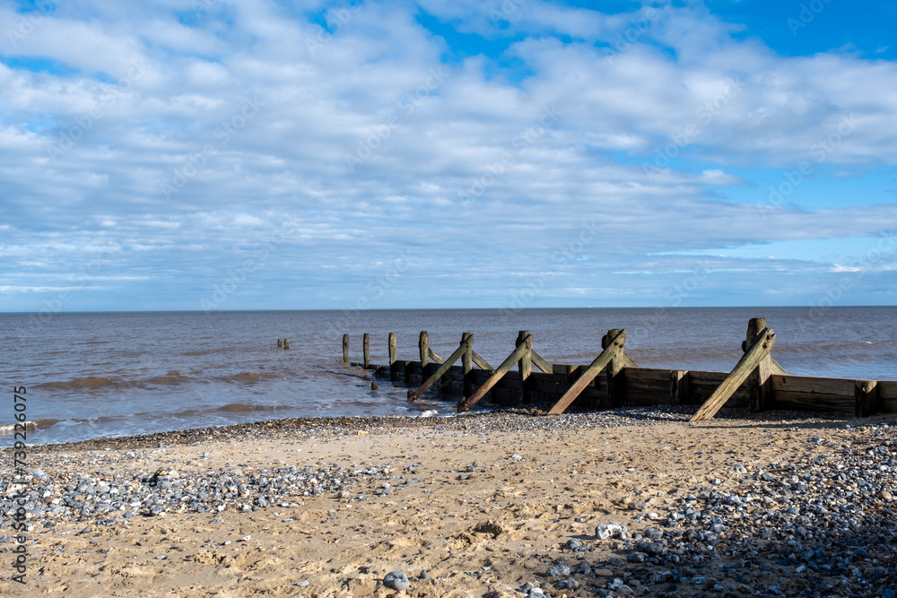 Wooden groynes and sea breakers protecting North Norfolk from coastal erosion