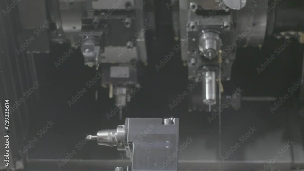 Modern CNC Machine operates with metal Modern CNC Machine operates with metal