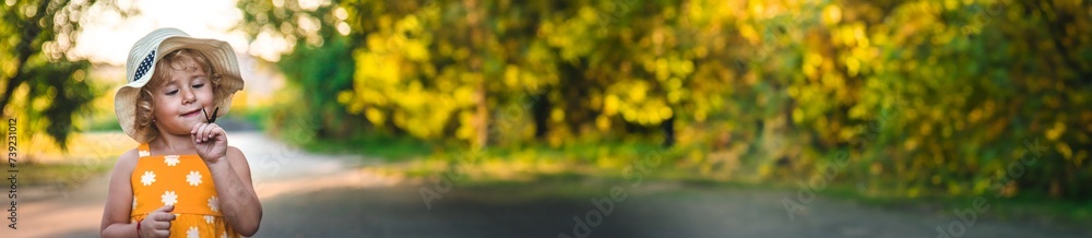 A child catches a butterfly in nature. selective focus. A child catches a butterfly in nature. selective focus.