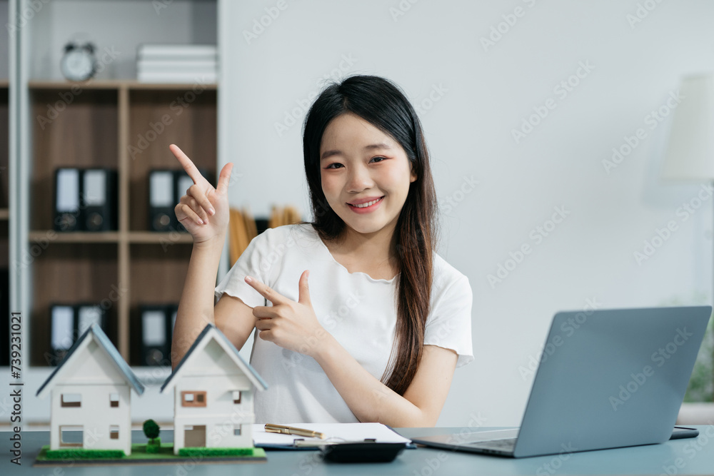 Happy young businesswoman presenting or pointing, happy working. Happy young businesswoman presenting or pointing, happy working.