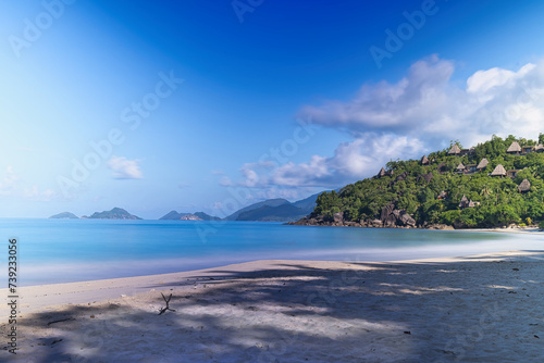 Fototapeta Naklejka Na Ścianę i Meble -  30 seconds long exposure of beautiful white sandy beach, granite rock boulders and turquoise water, Mahe, Seychelles