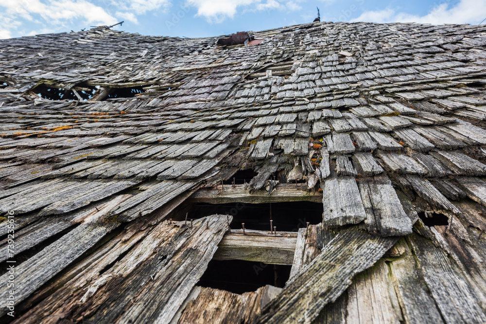 Close up, an old abandoned traditional wooden building in Romania mountain village, falling apart from the effects of atmospheric precipitation. Shallow depth of field. Close up, an old abandoned traditional wooden building in Romania mountain village, falling apart from the effects of atmospheric precipitation. Shallow depth of field.