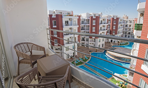 Terrace balcony with chairs in tropical luxury apartment resort