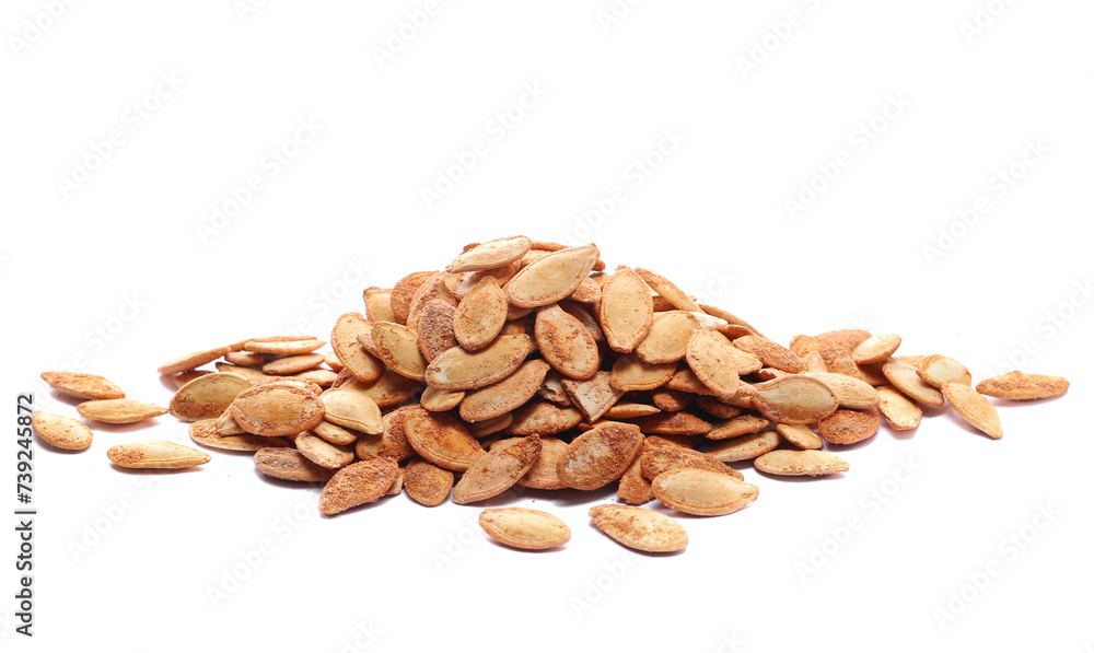 Pile roasted pumpkin seeds with salt isolated on white Pile roasted pumpkin seeds with salt isolated on white