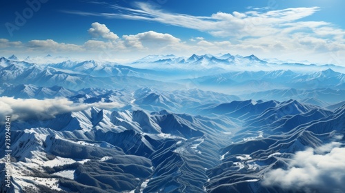 Snow-covered mountain range from the air, showcasing the majesty and isolation of the terrain, Photorealistic, aerial mountain photography, 85mm lens,
