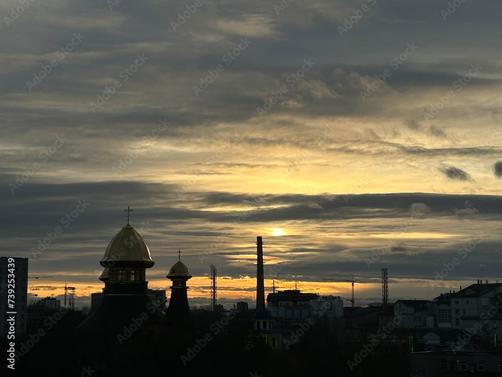 Panoramic view of the city during sunset with a very beautiful sky and silhouettes of buildings.