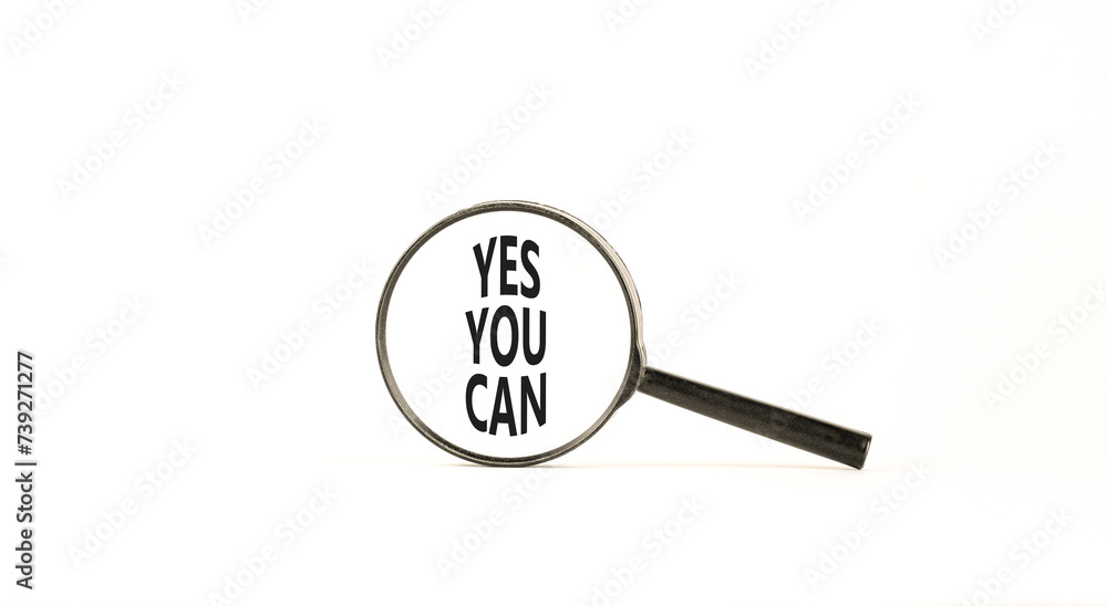 Motivational Yes you can symbol. Concept words Yes you can in beautiful magnifying glass. Beautiful white table white background. Business motivational and Yes you can concept. Copy space Motivational Yes you can symbol. Concept words Yes you can in beautiful magnifying glass. Beautiful white table white background. Business motivational and Yes you can concept. Copy space